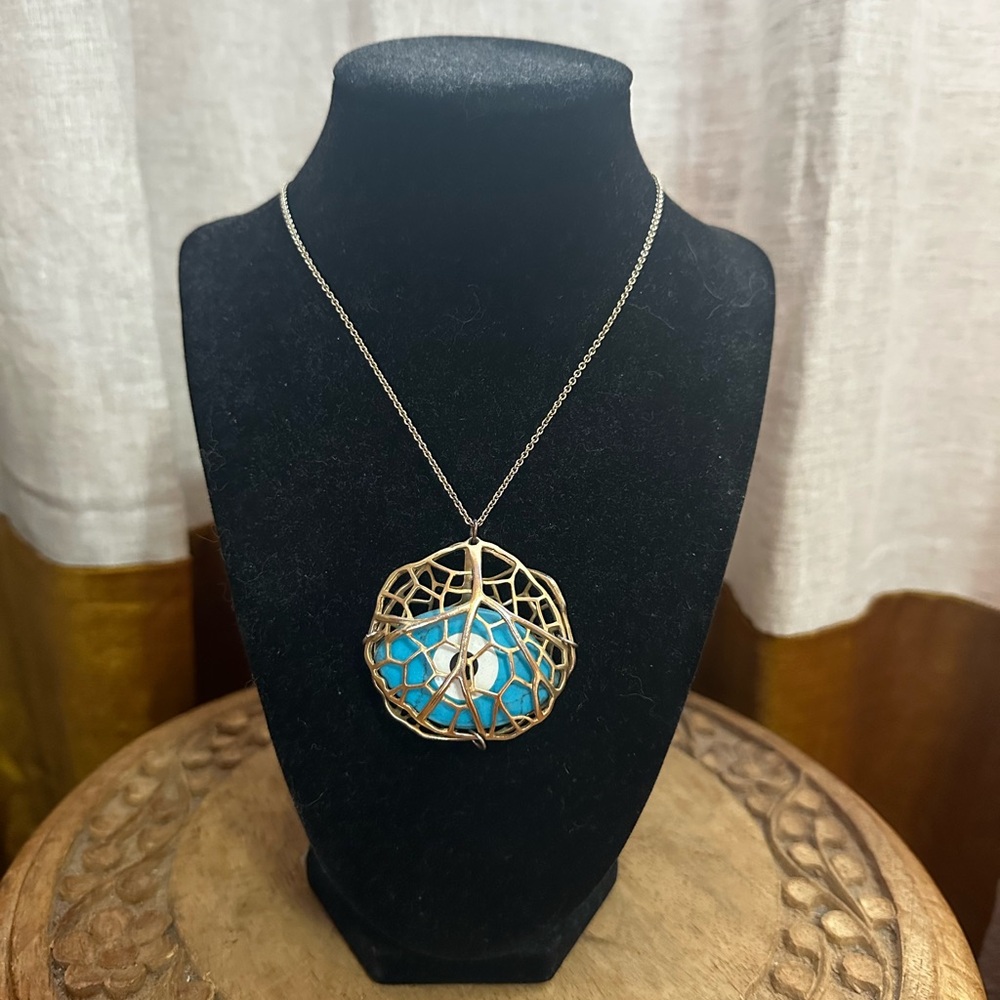 Elegant Silver and Blue Eye Pendant Necklace